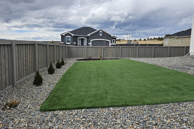 Freshly installed artificial turf lawn in a Colorado Springs backyard