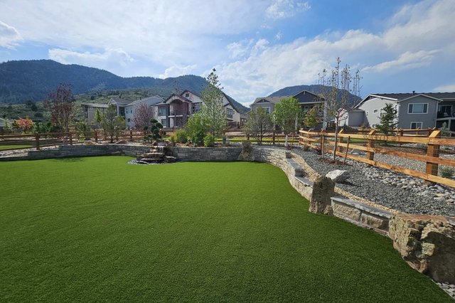 Backyard artificial turf putting green with practice flags in Colorado Springs