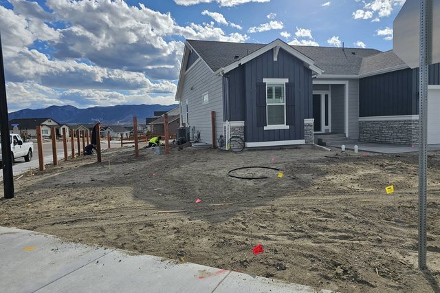 Irrigation lines and fence posts going in during a landscaping install in Colorado Springs
